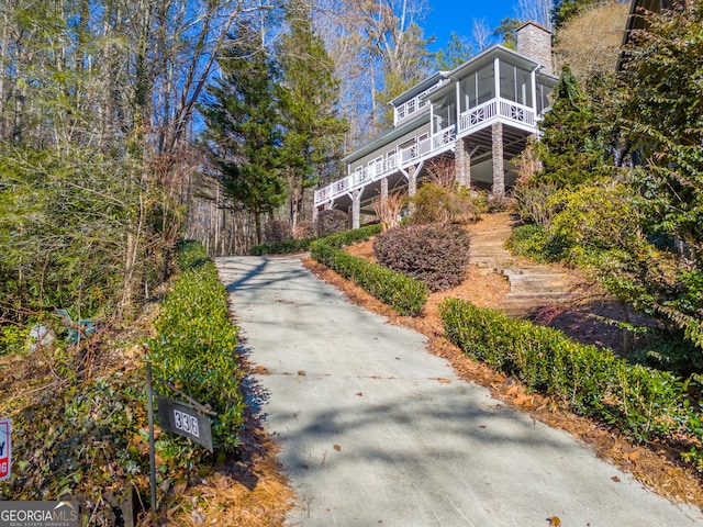 view of side of property featuring a sunroom