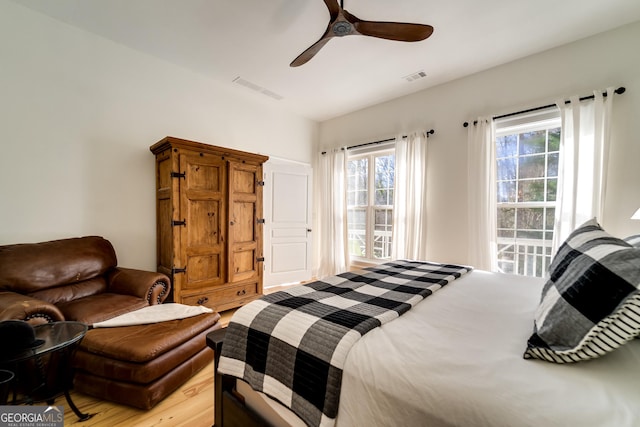 bedroom featuring light hardwood / wood-style flooring and ceiling fan