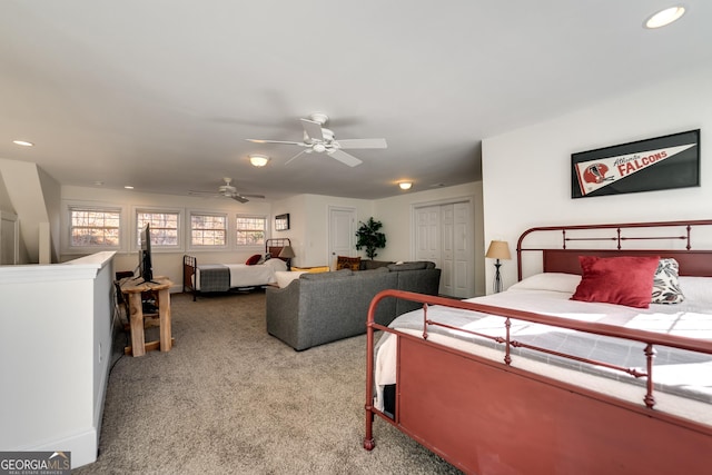 bedroom featuring ceiling fan and light carpet