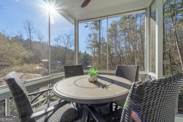 sunroom / solarium with ceiling fan