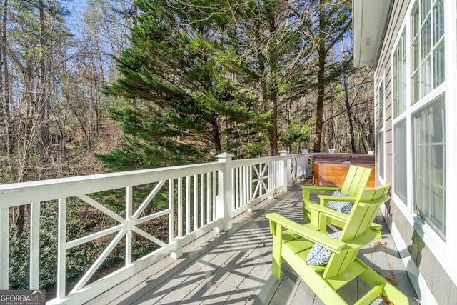 deck with a hot tub