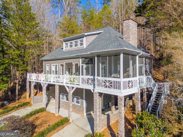 view of front of house with a sunroom