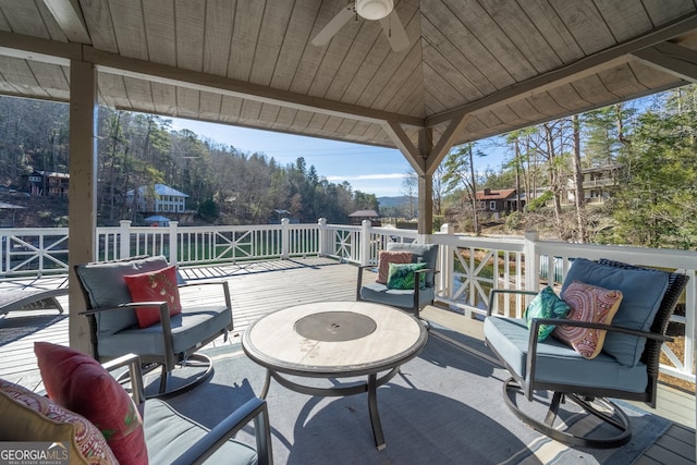 view of patio / terrace with a wooden deck, a gazebo, and ceiling fan