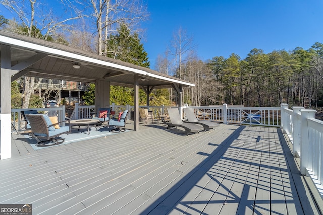 wooden terrace featuring a gazebo