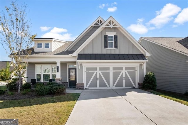 craftsman-style house with a garage, a front lawn, and a porch