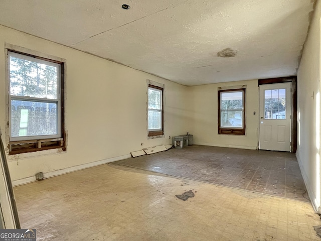 spare room featuring a textured ceiling