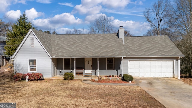 view of front facade with a garage and covered porch