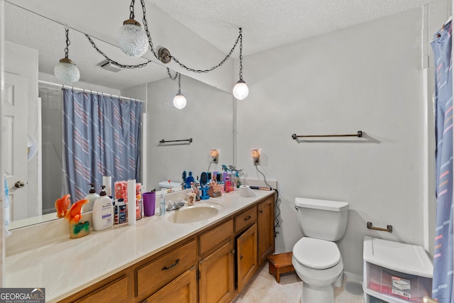 bathroom with vanity, walk in shower, a textured ceiling, and toilet