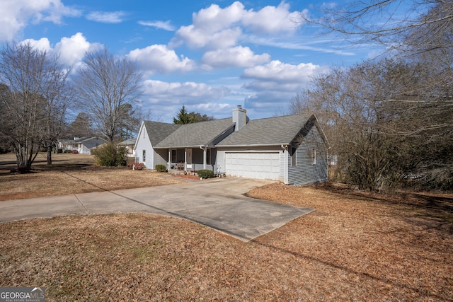 single story home featuring a garage and a porch