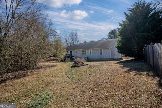 back of house with a yard