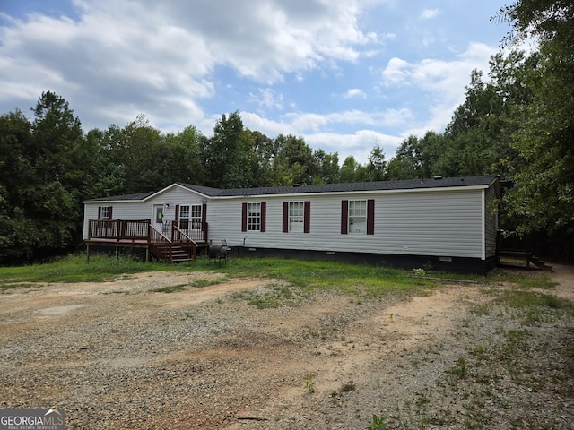 manufactured / mobile home featuring a wooden deck