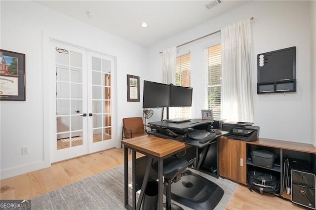 office space featuring light wood-type flooring and french doors