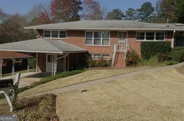 view of front of home with a carport