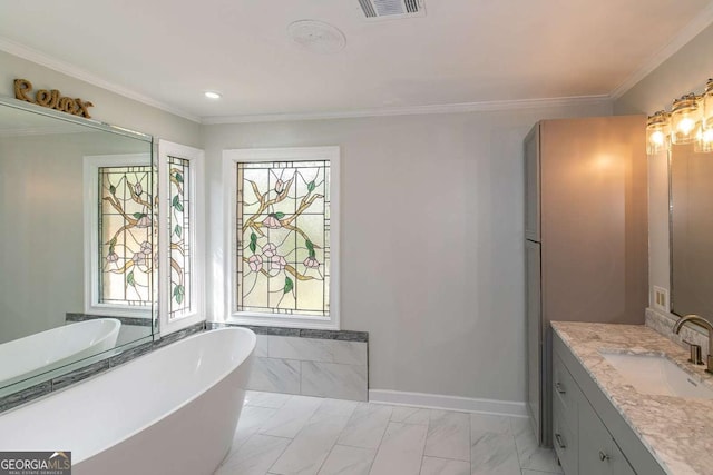 bathroom with ornamental molding, vanity, and a bath