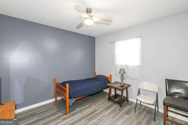 bedroom featuring ceiling fan and hardwood / wood-style floors