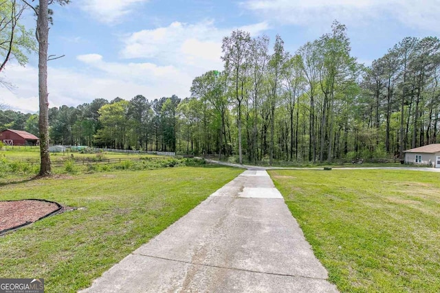 view of home's community featuring a yard