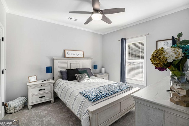 bedroom with ornamental molding, ceiling fan, and dark carpet