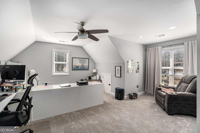 home office featuring lofted ceiling, light colored carpet, and ceiling fan