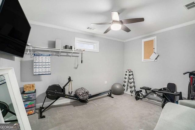 exercise room featuring light carpet, crown molding, and ceiling fan