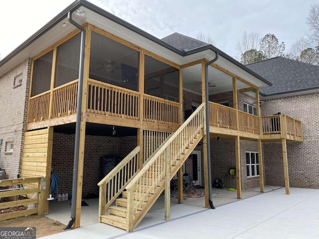 rear view of property with a patio, a sunroom, and ceiling fan