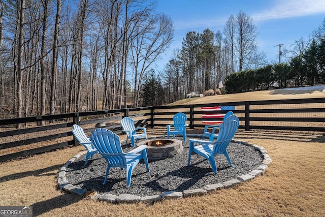 view of yard with an outdoor fire pit