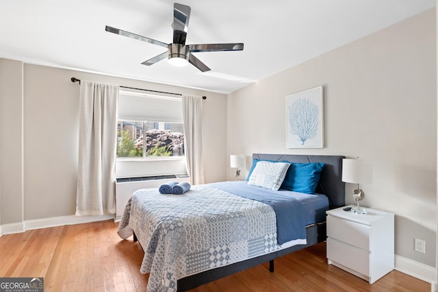 bedroom featuring ceiling fan and wood-type flooring