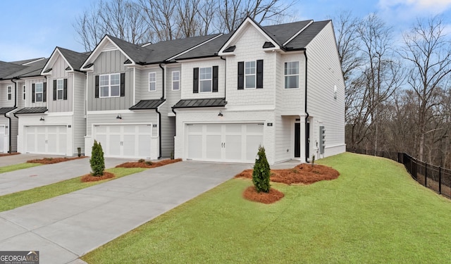 313 Sound Cir Unit 140, Stockbridge, GA 30281 - view of property featuring a garage, driveway, a standing seam roof, a front lawn, and a shingled roof