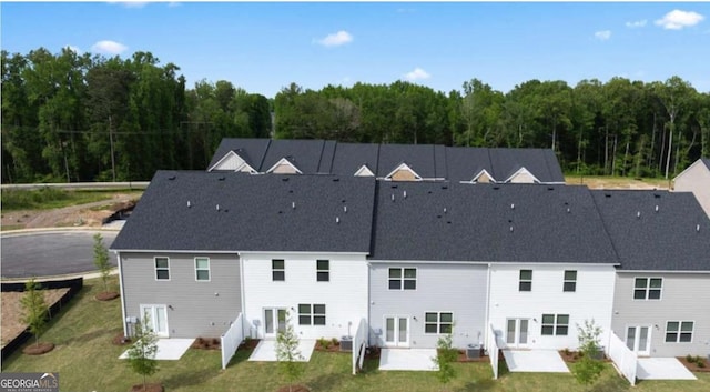 drone / aerial view featuring a yard and a patio area