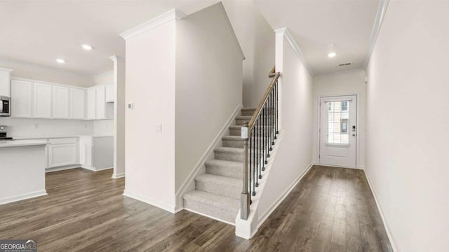 313 Sound Cir Unit 140, Stockbridge, GA 30281 - stairs featuring ornamental molding, wood finished floors, baseboards, and recessed lighting
