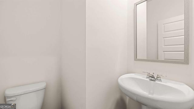 313 Sound Cir Unit 140, Stockbridge, GA 30281 - half bath with a sink and toilet
