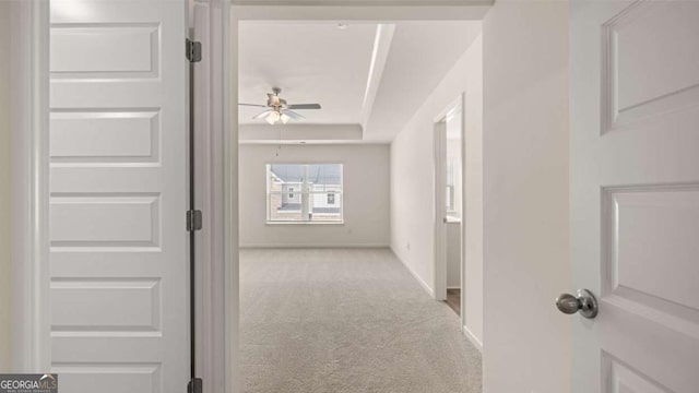 313 Sound Cir Unit 140, Stockbridge, GA 30281 - hall featuring carpet flooring, baseboards, and a raised ceiling