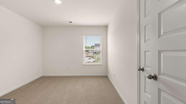 313 Sound Cir Unit 140, Stockbridge, GA 30281 - empty room with light colored carpet, baseboards, and recessed lighting