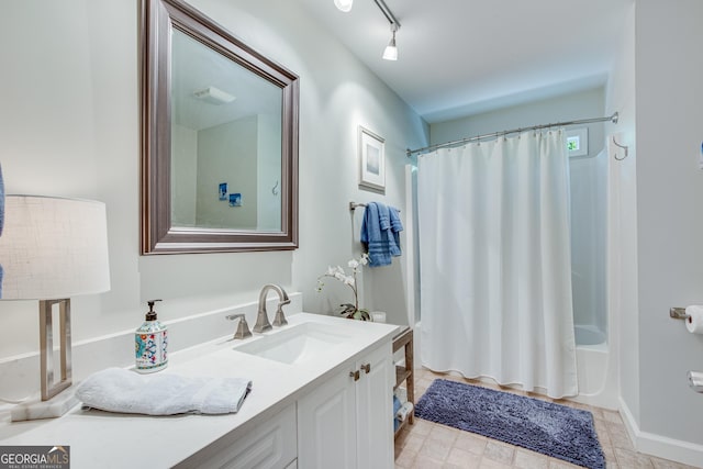 bathroom featuring shower / tub combo, vanity, and track lighting