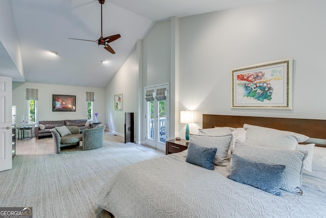 carpeted bedroom with multiple windows, high vaulted ceiling, access to outside, and ceiling fan