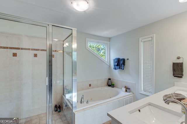 bathroom featuring separate shower and tub and vanity