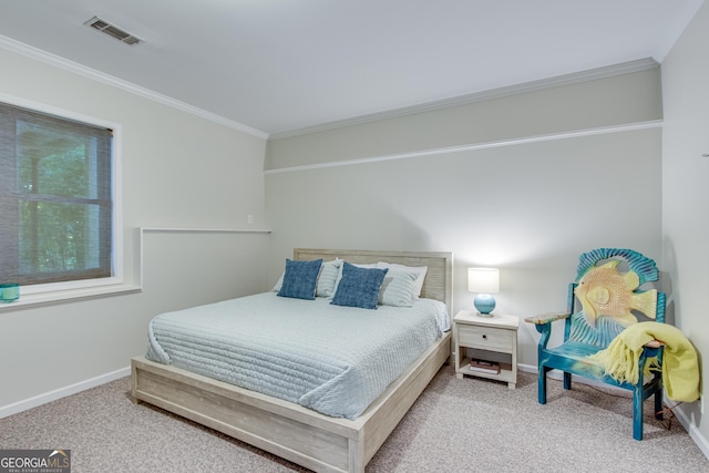 bedroom featuring crown molding and carpet