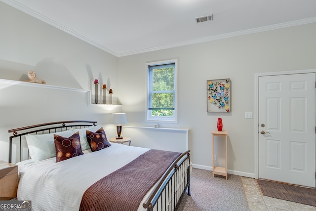 bedroom featuring crown molding and light colored carpet