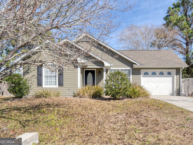 view of front facade with a garage and a front yard