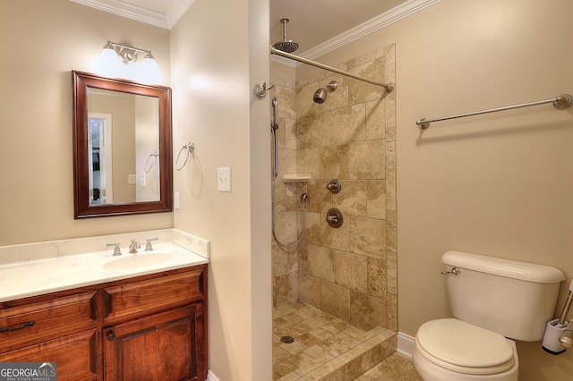 bathroom with ornamental molding, toilet, vanity, and a tile shower