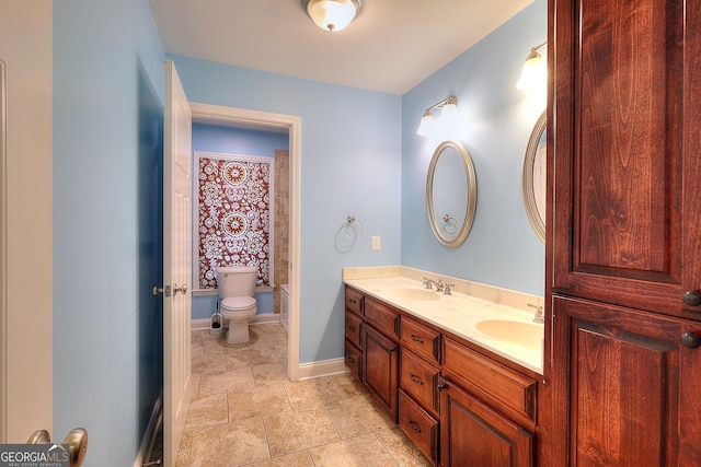 bathroom with vanity and toilet