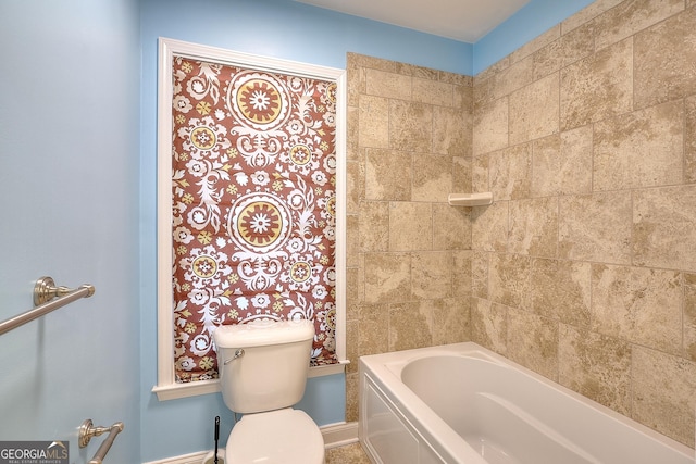 bathroom featuring toilet and a bathtub