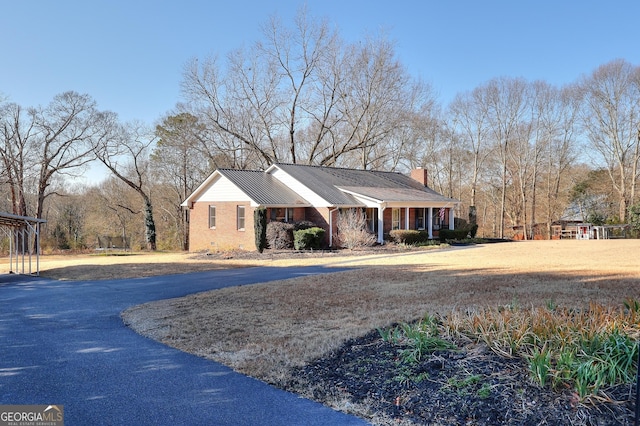 ranch-style home featuring covered porch