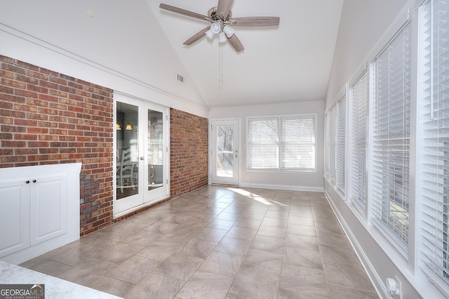 unfurnished sunroom featuring vaulted ceiling and ceiling fan