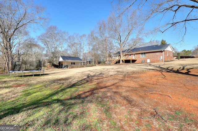 view of yard with a trampoline