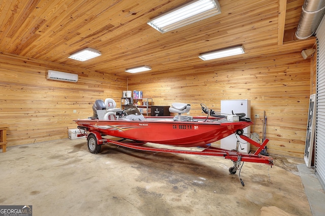 garage with wood ceiling and a wall mounted AC