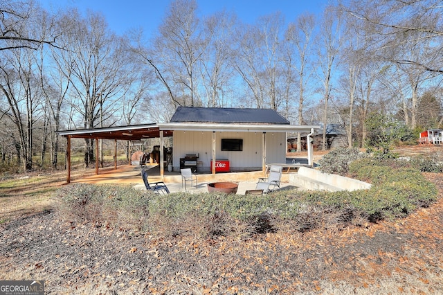 rear view of property featuring a patio