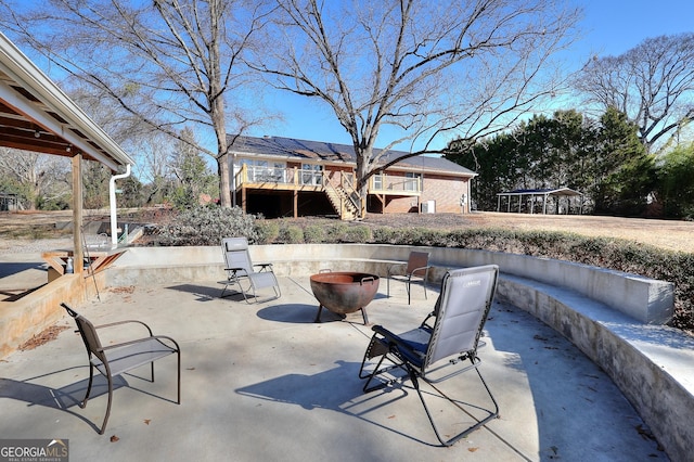 view of patio / terrace with an outdoor fire pit