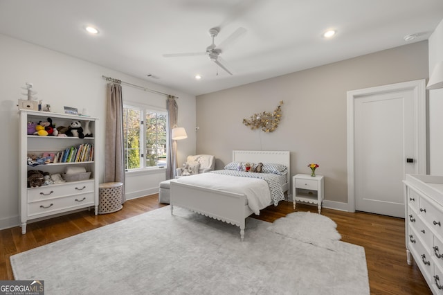 bedroom featuring dark hardwood / wood-style flooring and ceiling fan