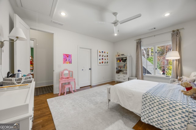 bedroom with ceiling fan and dark hardwood / wood-style flooring