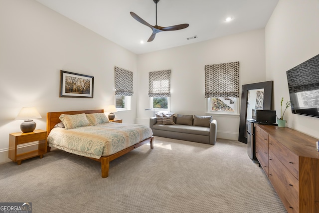 carpeted bedroom with ceiling fan